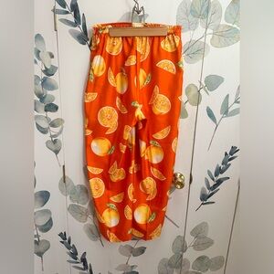 Bright orange fruit print fitted highwaisted pant
